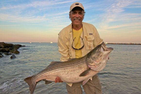 Shell E Caris with a 42lb bass. Caught on a pencil popper.published in Asbury Park Press 2011